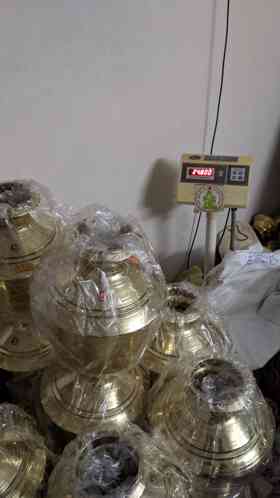 Brass kodams being weighed before dispatch